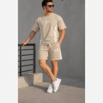 ست تیشرت شلوارک بیسکوییتی طرح UNDER ARMOUR نواردوزی شده - تصویر 2
